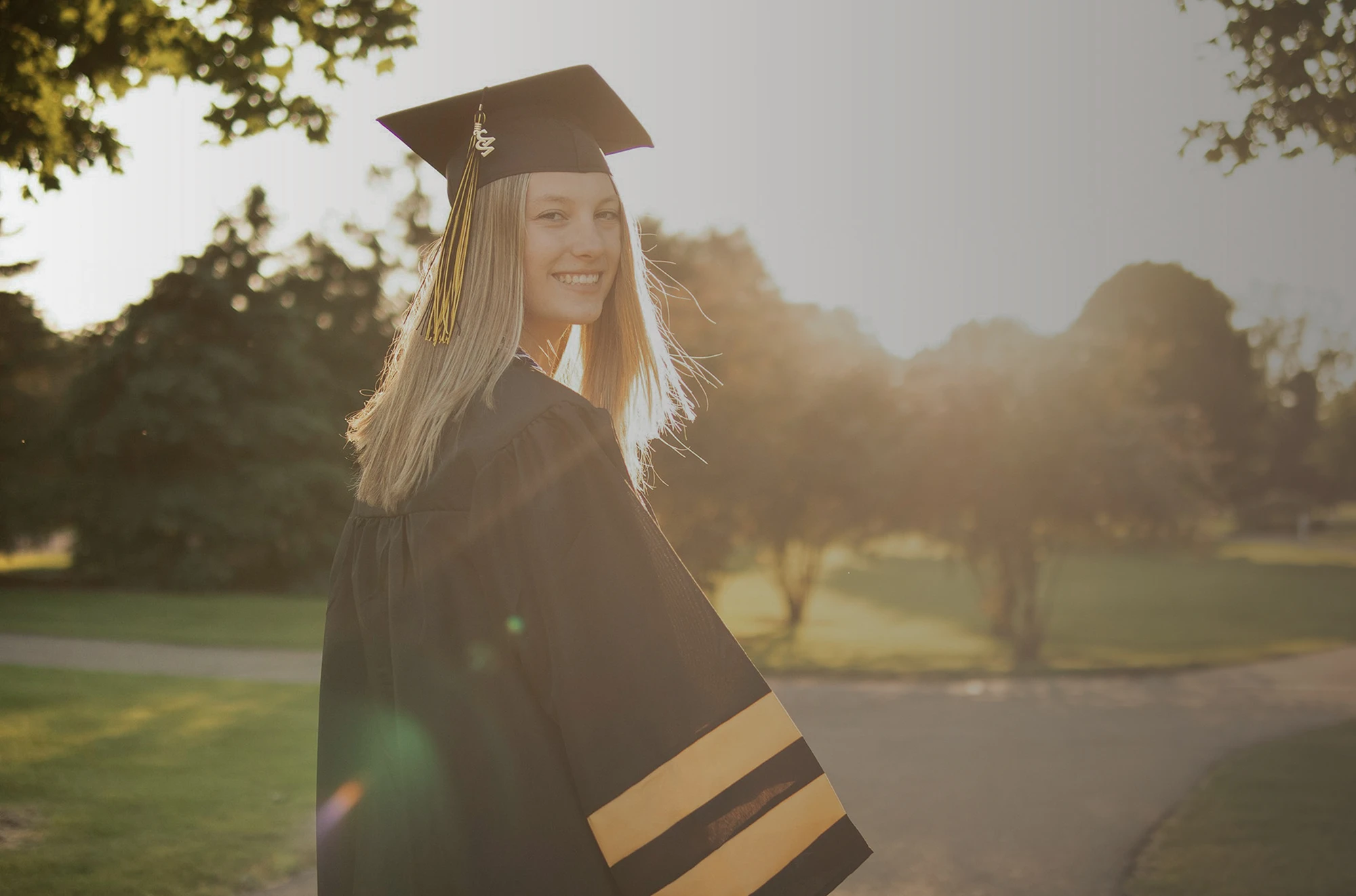 College graduate in cap and gown