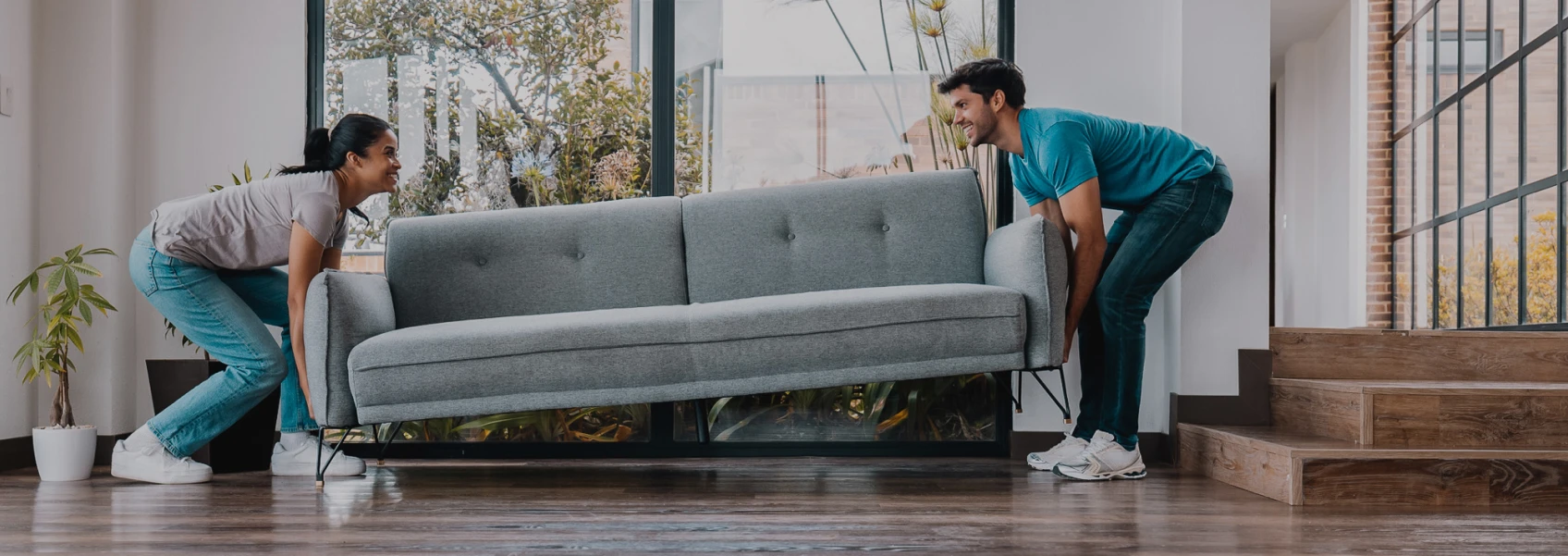 Couple moving furniture